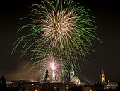 Fireworks over Schwaz on New Year's Eve with hospital church and parish church, Schwaz, Tyrol, Austria, Europe