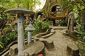 Garden, overgrown, mushroom and women's head sculptures, Crazy House Hotel, Hang Nga Guesthouse, Dalat, Central Highlands, Vietnam, Asia