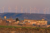 Wind turbines overlooking the village and nature reserve of Montmesa, Huesca, Aragon, Spain