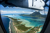 Aerial view of Bora-Bora through a porthole, French Polynesia