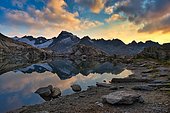 Grätlisee with reflection of the mountains and clouds in the morning light, Canton Valais, Switzerland, Europe