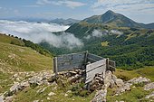 Shooting station for pigeon hunting in October. In the background, the Pic d'Orhy overlooking the Iraty forest and the sea of clouds, Lower Navarre, Atlantic Pyrenees, France