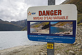 Sign indicating the danger of rising water from the Grand 'Maison dam installed on the Savoie side, France