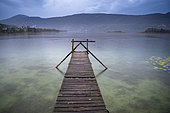 Jetty on Aiguebelette lake at dusk, Savoie, France