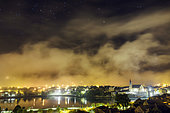 Night fog after a thunderstorm, the strong light pollution is highlighted here: the stars are barely visible, Seyssel, Haute Savoie, France
