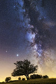 Saturn, Jupiter and the Milky Way over the Jura. Constellation of Sagittarius, and Scorpio on the right, with the star Antares, Crêtes du Grand Colombier, South of the Jura massif, France