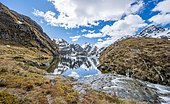 Mountains reflected in lake, Lake Harris, Conical Hill, Routeburn Track, Mount Aspiring National Park, Westland District, West Coast, South Island, New Zealand, Oceania