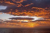 Dramatic cloudy sky, evening mood at the sea, in the back the island El Hierro, Valle Gran Rey, La Gomera, Canary Islands, Spain, Europe