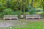 Wooden benches in a garden in autumn, Somme, France