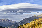 Lenticular cloud over the Ubaye valley in autumn, Alpes de Haute Provence, France