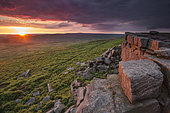 Sunset at Stanage Edge, UK. The sun sets over Stanage Edge in the Peak District, UK.