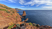 The creeks of Cap Dramont, in the Esterel Massif. A small classified and protected massif created by a volcanic activity dating from the Permian (primary era) and formed by rhyolites (porphyries) with brilliant colours under the setting sun. Var, France