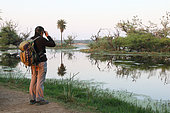 Birdwatching at the edge of a swamp in the evening, Keoladeo NP North West India