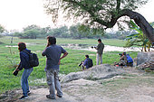 Wildlife photographers at the edge of a swamp Keoladeo NP, North West India