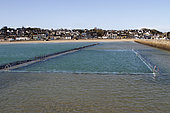 Seawater pool filling up with the tide in Binic, Côtes-d'Armor, Brittany, France