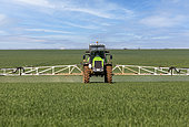 Chemical treatment of crops with very wide spreading behind a tractor, field crops, agricultural territories, Senlis region, Department of Oise, France