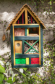 Insect hotel against a wall , insect shelter made of different materials, Rocambole gardens, Artistic vegetable and botanical gardens in organic farming, A meeting between art and Nature, La Lande aux Pitois, Corps Nuds, Ille-et-Vilaine (35), Brittany, France