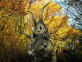 A one ton, 20 foot long Diabloceratops wanders a Cretaceous forest 70 million years ago in what is today Utah. . Like the better known Triceratops, Diabloceratops was a Ceratopsid, a large four-legged plant-eating dinosaur characterized by beaks, rows of shearing teeth in the back of the jaw, and elaborate horns and frills. While they resemble defensive shields, the frills are in fact relatively fragile, suggesting that they may have served a purpose other than protecting against a brute force attack. One possibility is that the frills were employed as visual displays in order to intimidate rivals and attract the opposite sex.