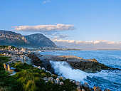 View across Walker Bay from Sievers Point with one of the many benches on the Cliff Path. Kleinrivier Mountains in the background. Hermanus. Whale Coast. Overberg. Western Cape. South Africa