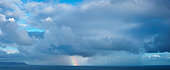 Rain squall, rainbow and storm at sea. Hermanus, Whale Coast, Overberg, Western Cape. South Africa