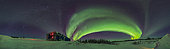 February 7, 2019 - A panorama of the sweeping arc of the auroral oval across the northern sky, with the stars of the winter sky to the south at left, over the Churchill Northern Studies Centre, in Churchill, Manitoba, Canada.