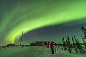 February 8, 2019 - A photographer and volunteer at the Churchill Northern Studies Centre photographs the aurora from up the Rocket Range Road at the Centre.