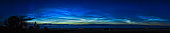A grand display of noctilucent clouds on June 7-8, 2020 with the NLCs very bright to the northwest and north and early in the evening. . The illumination dropped quickly to reduce the NLCs to a bright band low across the horizon and then to disappear. The clouds exhibit a tremendous amount of fine structure and wave patterns. Capella, usually present in NLC images, is just right of centre. 

