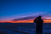 December 8, 2018 - Astronomer observing the grouping of Venus and Saturn in the evening twilight.