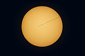 A composite of the November 11, 2019 transit of Mercury across the disk of the Sun, on a day with no sunspots on the Sun. . . North is up here, with Mercury moving from left to right, east to west, across the Sun above the ecliptic which itself is angled up in relation to the cardinal directions. 
