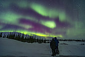 March 18, 2020 - A couple watches an aurora display in Churchill, Manitoba, Canada. Arcturus is the bright star at right in the northeast.
