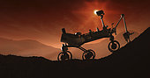The Martian sun sets behind Curiosity as it struggles up the rugged slopes of Mount Sharp. If it succeeds in its climb, the rover will have completed the longest, highest extraterrestrial mountaineering journey ever attempted.