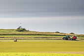 Making straw bales with a hay press in summer, Opal Coast, Pas de Calais, France