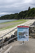 Sign warning of the danger of decaying green algae on the beach of Binic, Côtes d'Armor, Brittany, France