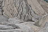 Rain erosion of quarry sand stocks, France