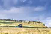 Farmer stubble ploughing his field, Côte d'Opale, Pas de Calais, France