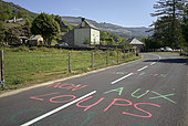 "Death to the wolves", inscription on the road during the Tour de France, Parc naturel des volcans d'Auvergne, France