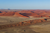 An aerial view of red sand dunes in the Namib desert. Namib Naukluft Park, Namib Desert, Namibia.