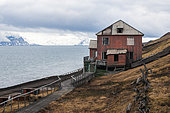 A house on the coast of the Russian settlement, Barentsburg. Barentsburg, Spitsbergen Island, Svalbard, Norway.