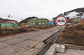 Houses off a concrete road in the Russian settlement of Barentsburg. Barentsburg, Spitsbergen Island, Svalbard, Norway.