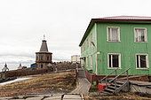 An orthodox church and houses in a Russian settlement. Barentsburg, Spitsbergen Island, Svalbard, Norway.