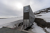 The entrance to the Svalbard Global Seed Vault built into a snow covered mountain. Longyearbyen, Spitsbergen Island, Svalbard, Norway.