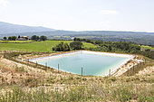 Artificial pond for irrigation. The water comes under pressure from the Durance river, Luberon Regional Nature Park, Vaucluse, France