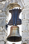 House sparrow (Passer domesticus) on the church bell of the village of La Martre, Parc Naturel Régionale du Verdon, France