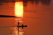 Fishermen at dawn in the Luangwa River, South Luangwa National Park, Zambia