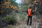 Man hunting in a forest of the Vaucluse, France