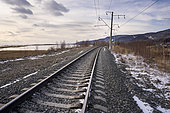 Railway of the famous BAM Baikal-Amour line passing north of Lake Baikal in the village of Dushkachan not far from Severobaikalsk, Buryatia, Russia