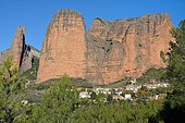 The Mallos de Riglos overlooking the village of Riglos, an area with important colonies of vultures and a paradise for climbers, Aragonese Pyrenees, Huesca, Spain