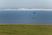 Paraglider facing the Cliffs of Dover on the English coast, Sangatte, Pas de Calais, France