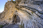 The Boules refuge, Alpes de Haute Provence, France. Astonishing refuge installed in an anticline of cretaceous limestone strata, Issole Valley, Thorame Basse, Haute Provence