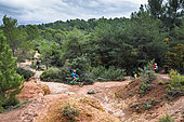 Mountain bikers in the ochre of the Luberon, France